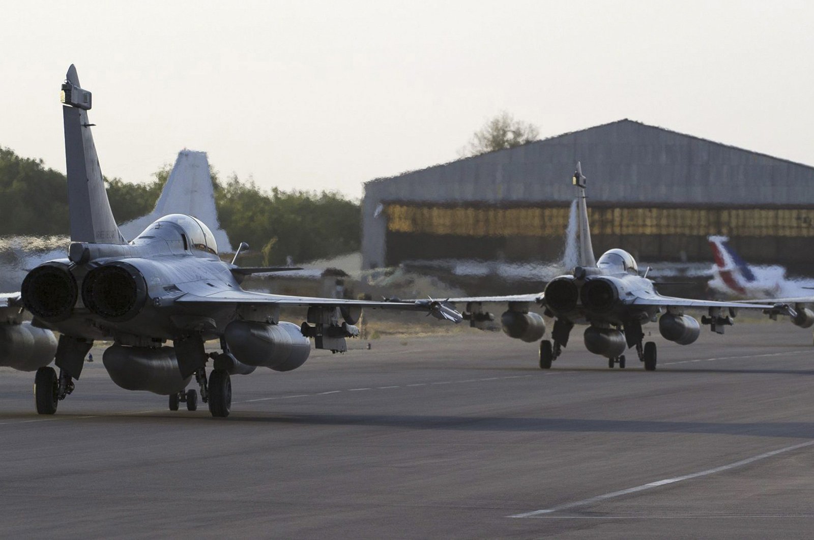 French Rafale fighter jets taxi on the runway, before their deployment in Mali, after landing in Ndjamena, Chad, Jan. 13, 2013.  (French Military Communications Audiovisual office via Reuters)