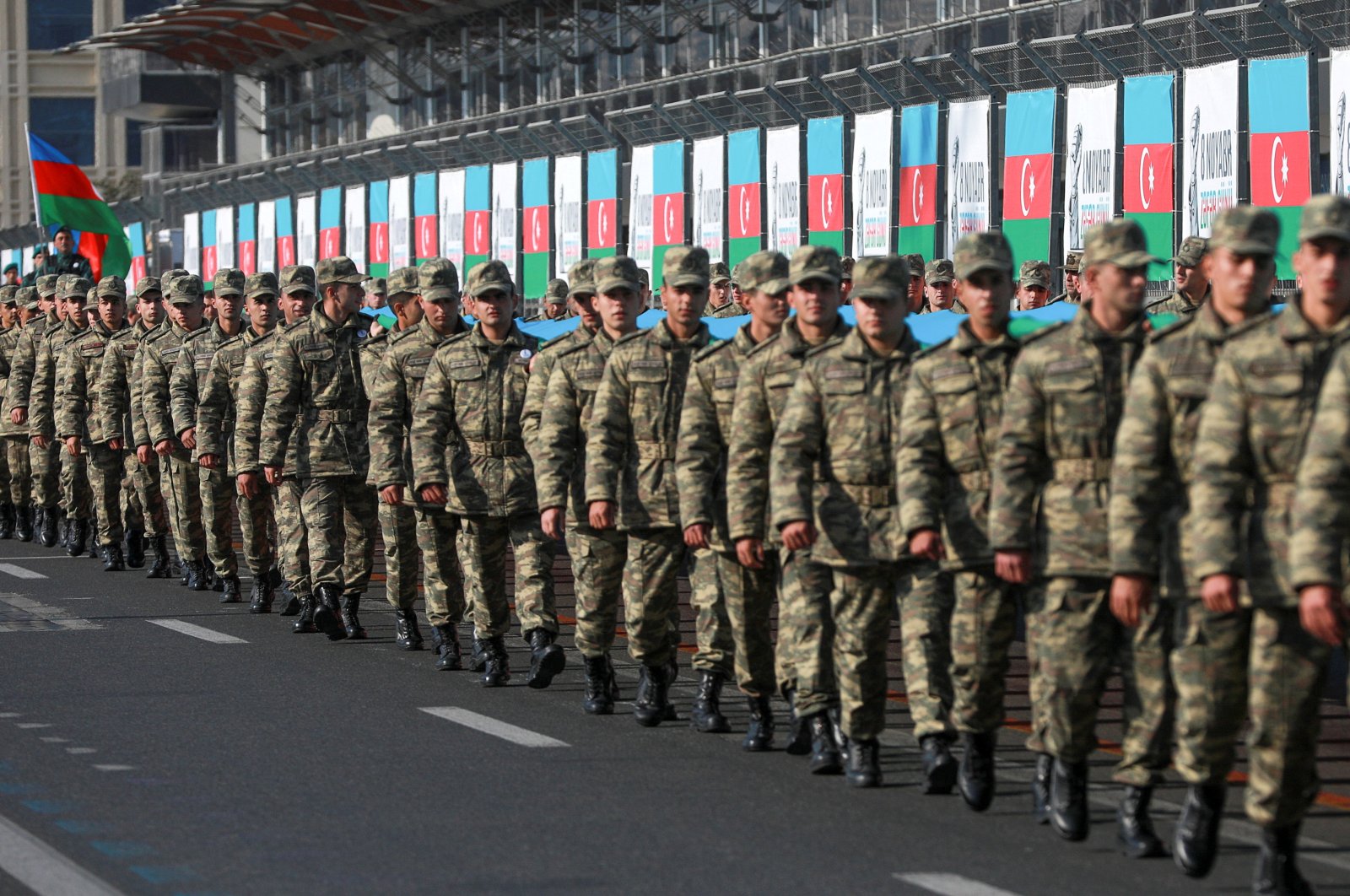 Azerbaijani service members take part in a procession marking the anniversary of the end of the 2020 military conflict over Nagorno-Karabakh in Baku, Azerbaijan, Nov. 8, 2021. (Reuters Photo)