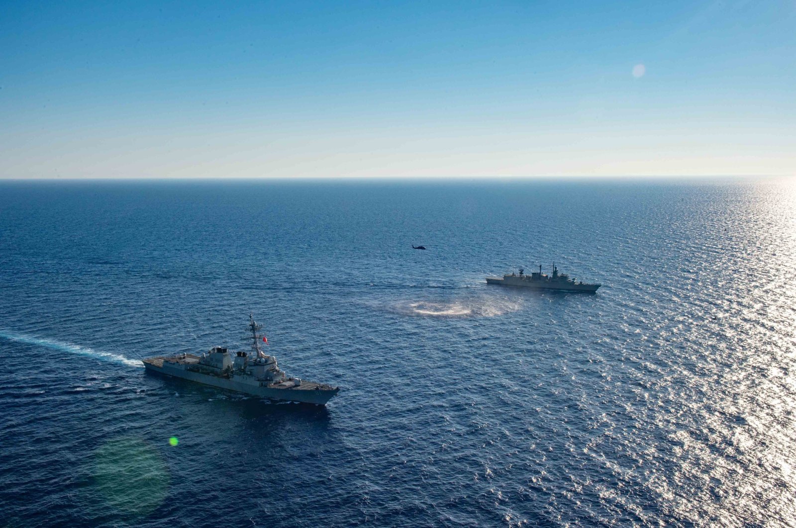 This handout photo dated Aug. 24, 2020, shows the Arleigh Burke-class guided-missile destroyer USS Winston S. Churchill (DDG 81) executing maneuvering drills with the Greek navy warship Kortenaer FF Class Aegean (F 460) off the coast of Crete, in the Mediterranean Sea. (Reuters Photo)