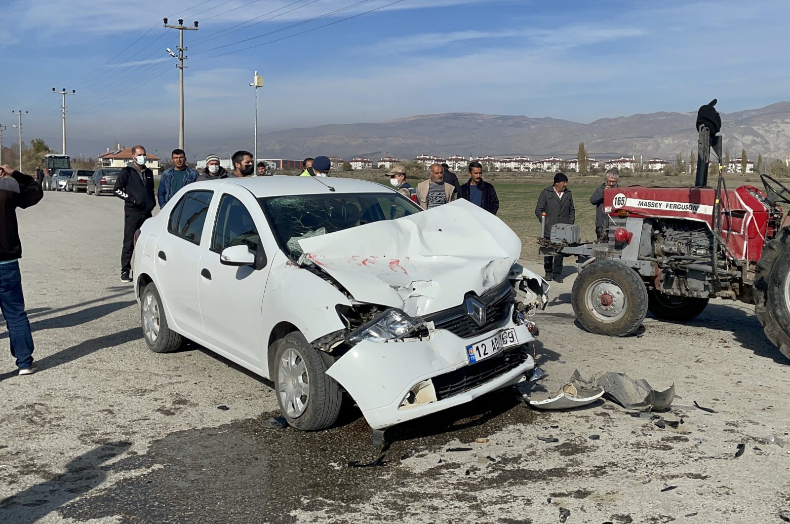 A wrecked car is seen after it crashed into a tractor, in Erzincan, eastern Turkey, Nov. 14, 2021. (AA PHOTO)