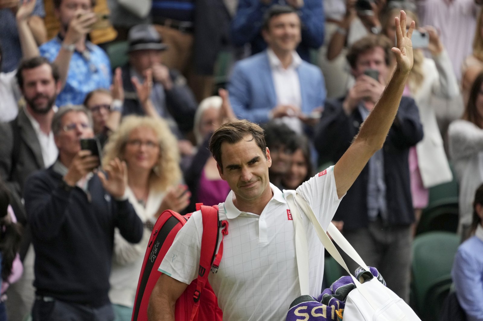 Roger Federer leaves the court after a match in London, England, July 7, 2021. (AP PHOTO)