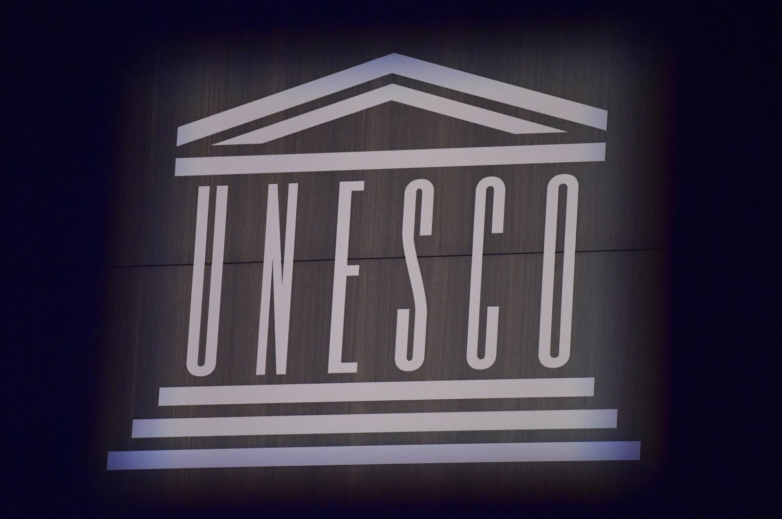 This photograph shows the logo of UNESCO during celebrations marking the 75th anniversary of the organization at its headquarters in Paris, Nov. 12, 2021. (AP Photo)