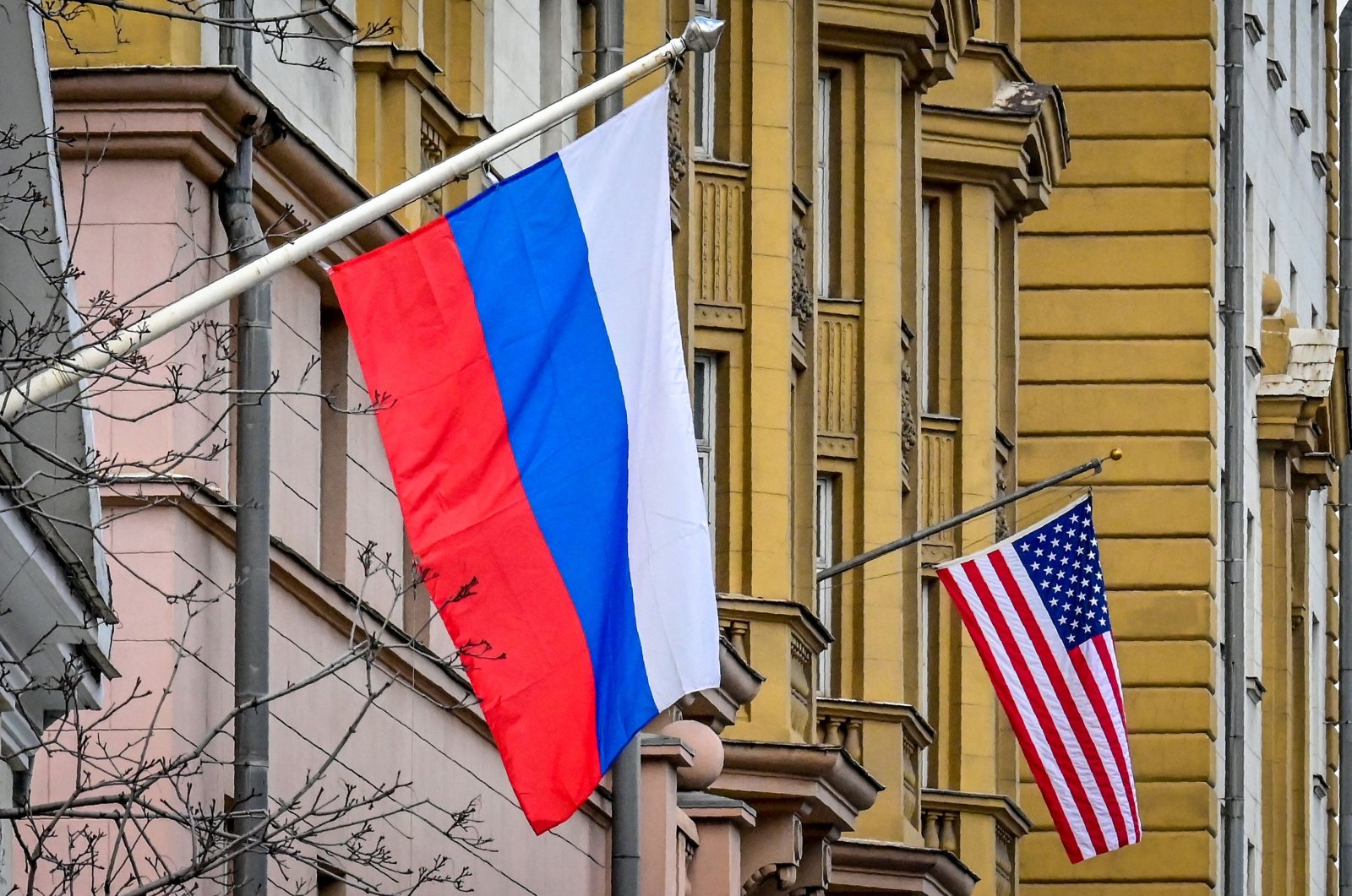 A Russian flag flies next to the U.S. embassy building in Moscow, March 18, 2021. (AFP File Photo)