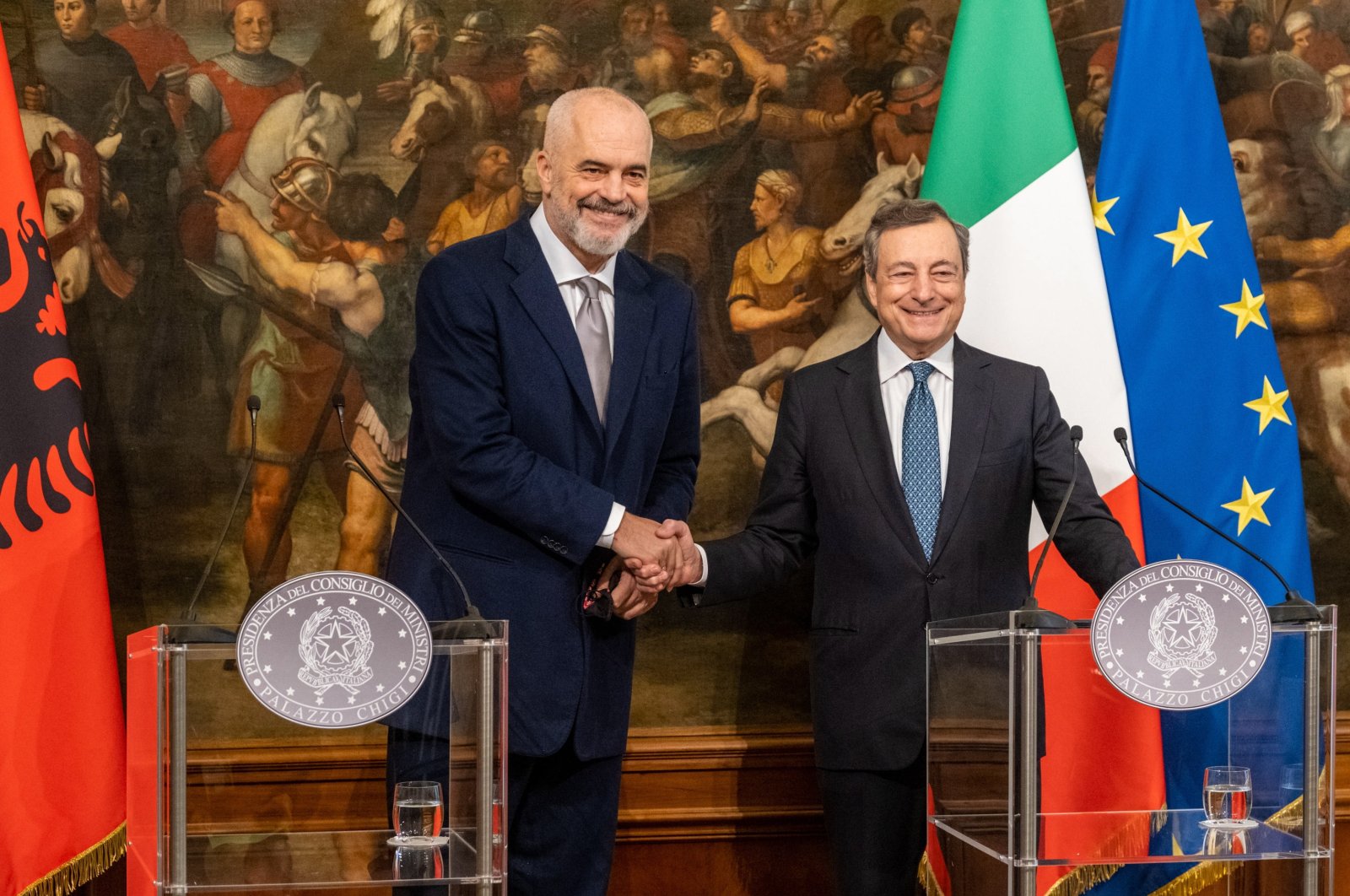 Italian Prime Minister Mario Draghi (R) and his Albanian counterpart Edi Rama (L) shake hands during a joint press conference following their meeting at Chigi Palace in Rome, Italy, Nov. 17, 2021.  (EPA Photo)