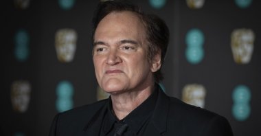 Director Quentin Tarantino poses for photographers arriving at the Bafta Film Awards, in central London, U.K., Feb. 2, 2020. (AP)