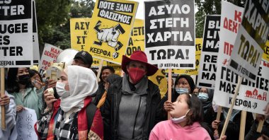Dutch journalist Ingeborg Beugel (C), who questioned Greece’s treatment of refugees and accused it of illegal pushbacks, takes part in a rally in Athens, Greece, Nov. 17, 2021. (AFP Photo)