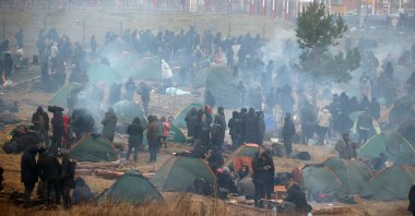 Migrants aiming to cross into Poland are seen in a camp near the Bruzgi-Kuznica border crossing on the Belarusian-Polish border, Nov. 17, 2021. (AFP Photo)