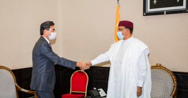 Niger President Mohamed Bazoum (R), shakes hands with Turkey's Ambassador Mustafa Türker Arı in Niamey, Niger, Nov. 16, 2021. (AA Photo)