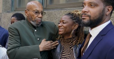 Muhammad Aziz, left, stands outside the courthouse with members of his family after his conviction in the killing of Malcolm X was vacated, Thursday, Nov. 18, 2021, in New York. (AP Photo)