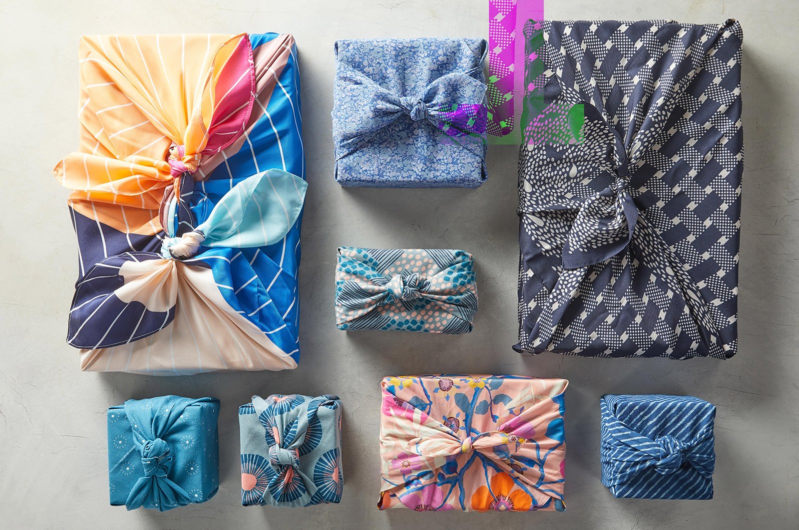 This image provided by Better Homes & Gardens shows fabric-wrapped gifts. (Jacob Fox/Better Homes & Gardens via AP)