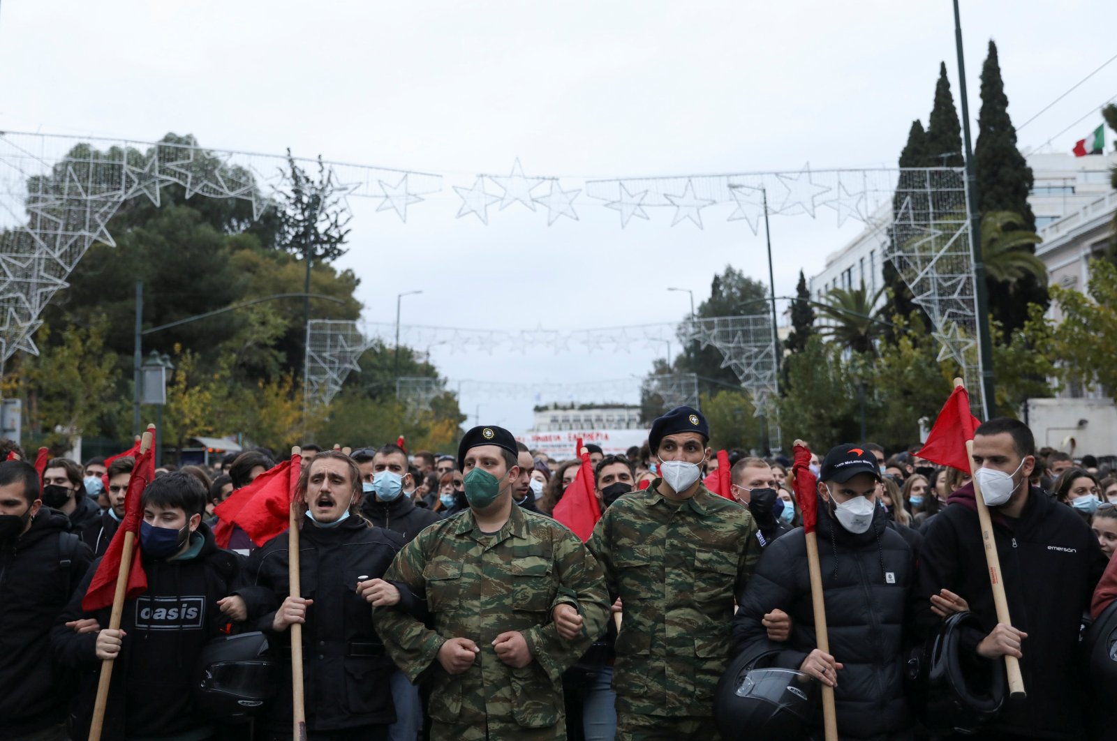 People dressed as soldiers march towards the U.S. Embassy during a rally marking the 48th anniversary of 1973 Athens Polytechnic student uprising, in Athens, Greece, Nov. 17, 2021. (Reuters Photo)