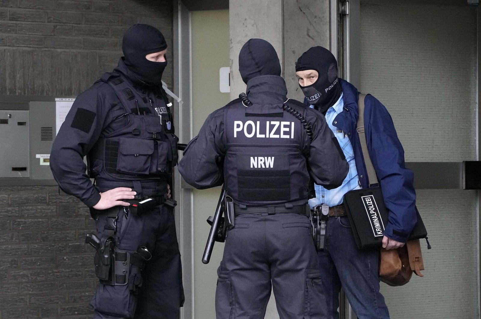 Police investigate as part of raids in several German cities, Dusseldorf, Germany, Oct. 6, 2021. (AP File Photo)