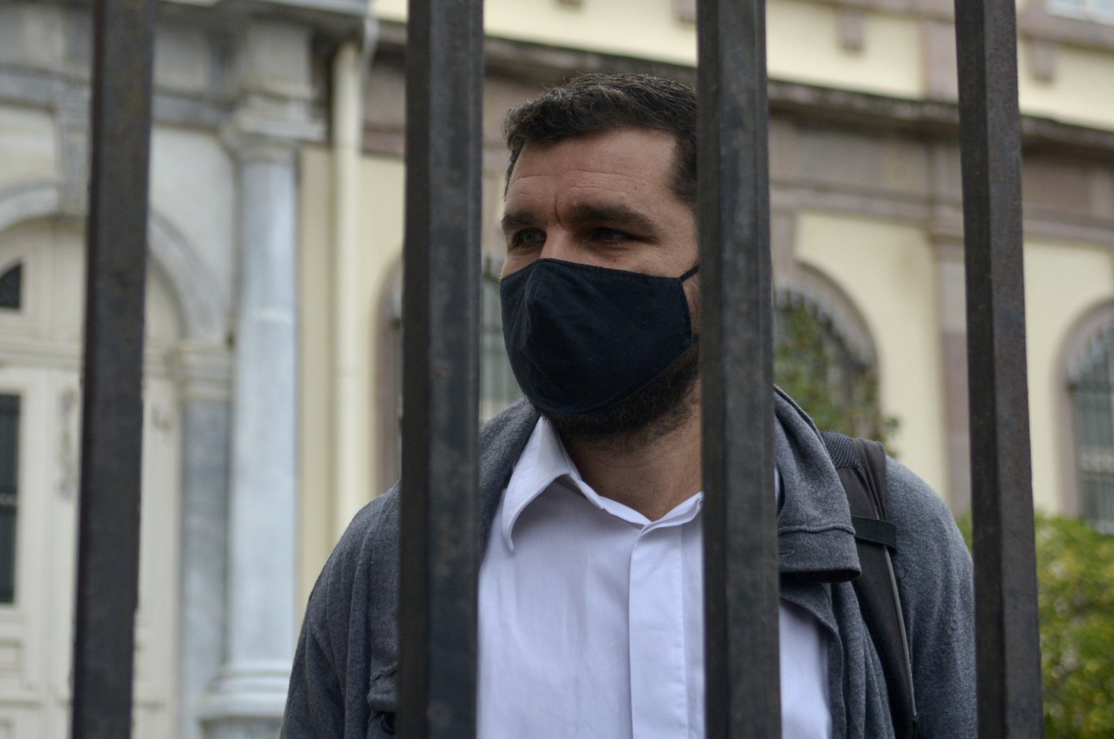 Greek Nasos Karakitsos stands at the yard of a court before his trial in Mytilene port, on the northeastern Aegean island of Lesbos, Greece, Nov. 18, 2021. (AP Photo)