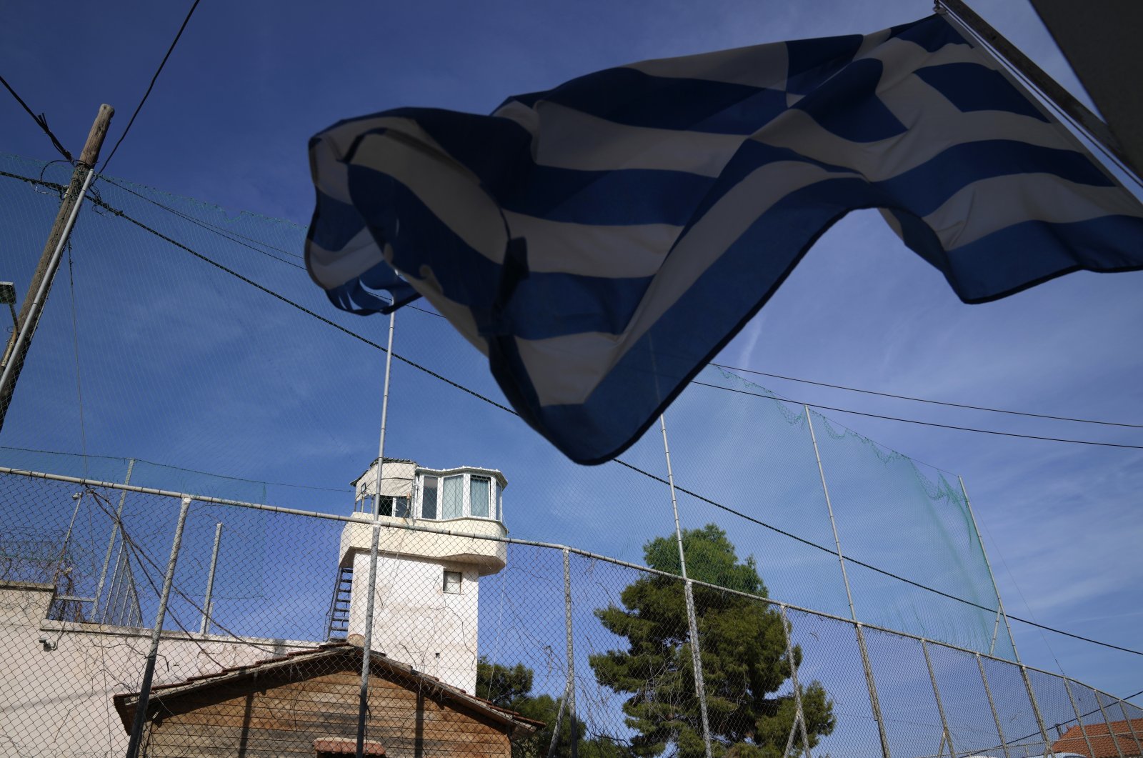 A Greek flag waves outside a prison on the northeastern Aegean island of Chios, Greece, Nov. 6, 2021. (AP Photo)