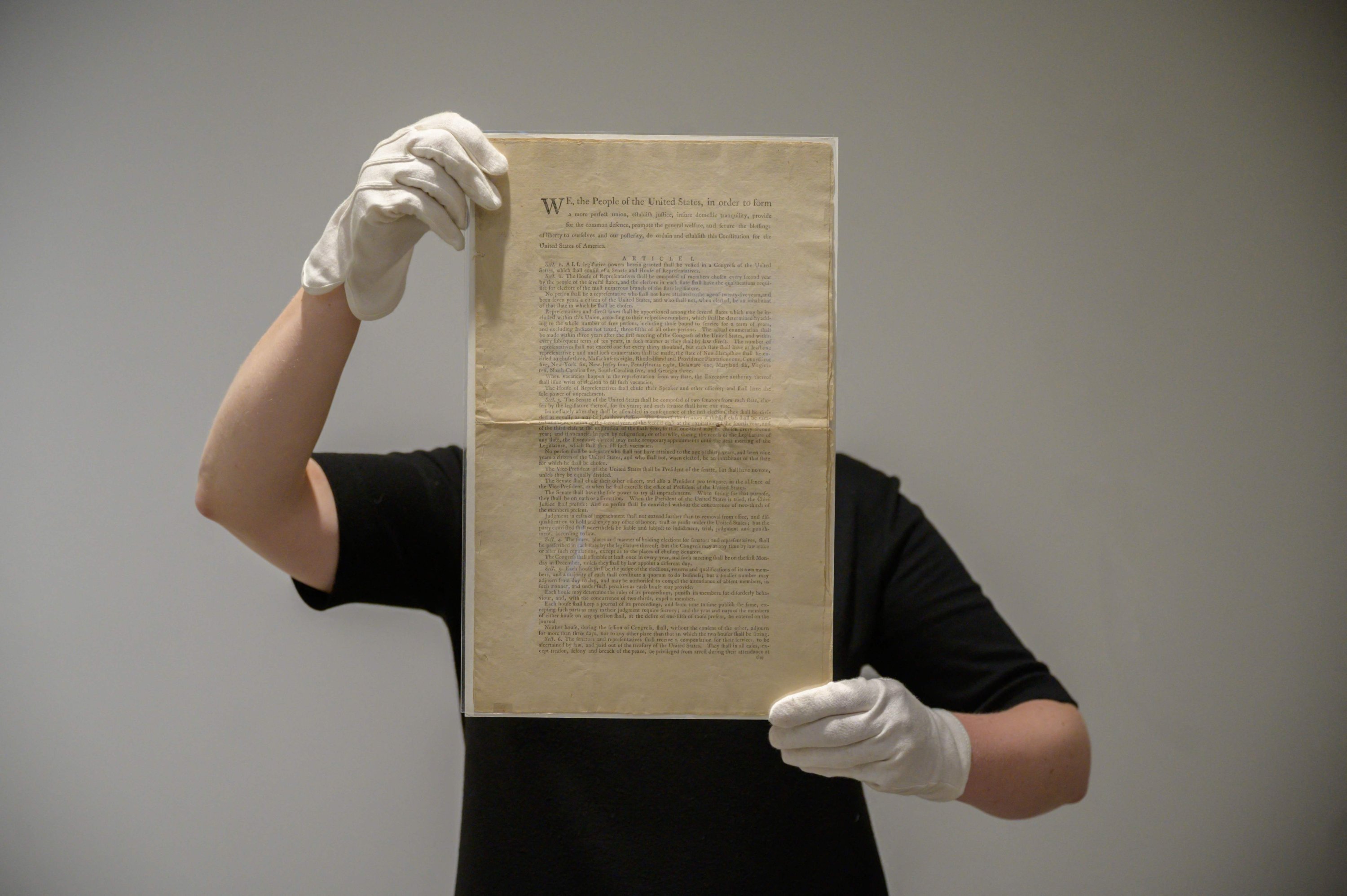 A page of the first printing of the United States Constitution is displayed at the offices of Sotheby's auction house in New York, U.S., Sept. 17, 2021. (AFP Photo)