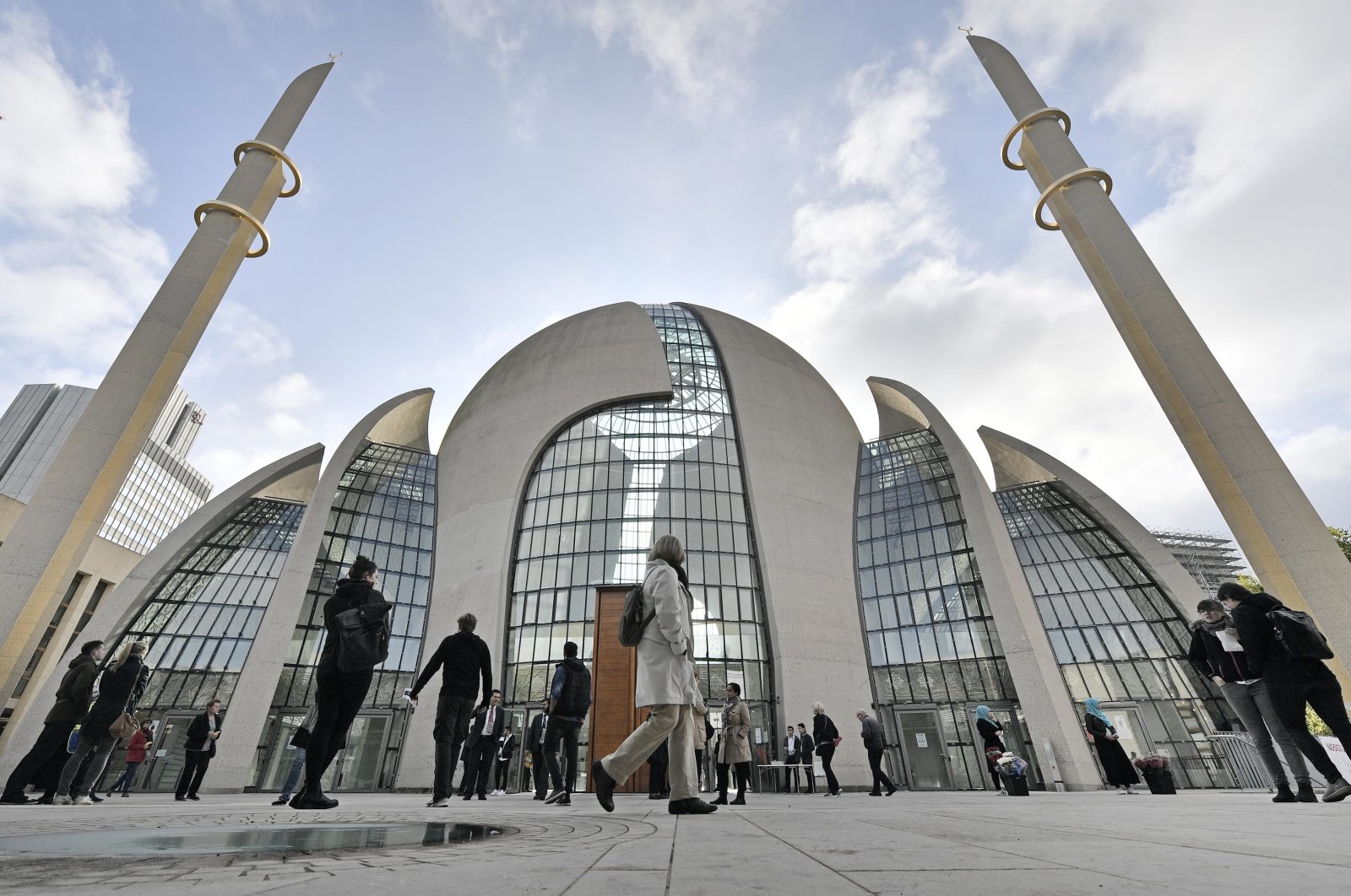 People stand outside the central mosque on the "Day of Open Mosques" in Cologne, Germany, Oct. 3, 2017. (AP File Photo)