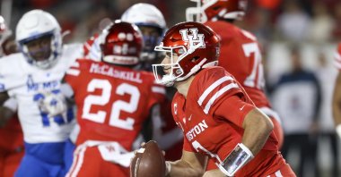 Houston Cougars quarterback Clayton Tune (3) rushes against the  Memphis Tigers in the second quarter at TDECU Stadium, Houston, Texas, U.S., Nov. 19, 2021. (Thomas Shea-USA TODAY Sports via Reuters)