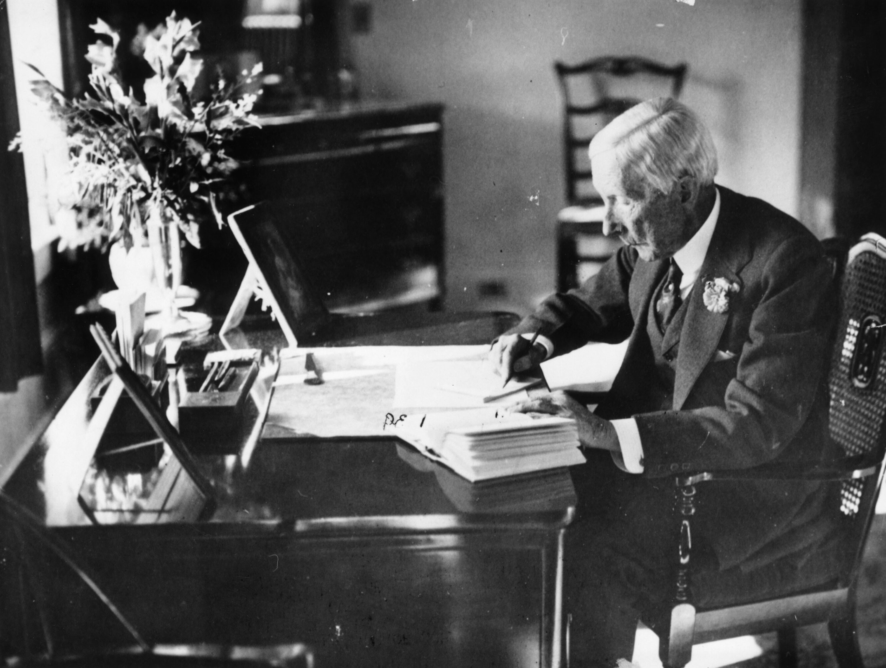 American oil magnate John D. Rockefeller works in his study. (Getty Images)