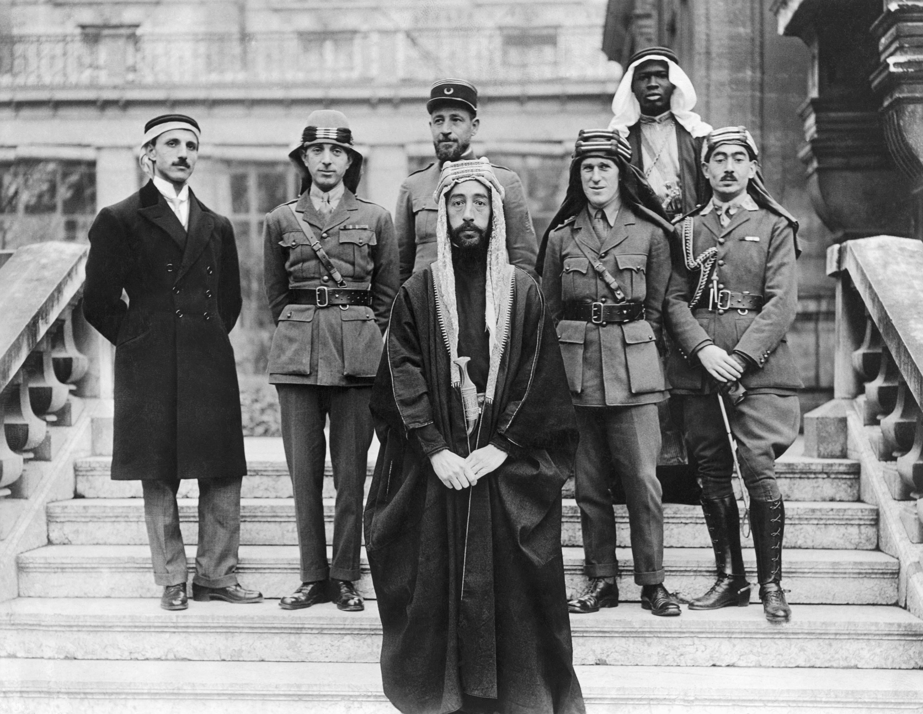 King Faisal of Iraq (C) with his delegates and advisors, including T. E. Lawrence (C-R), at the Versailles peace conference, Paris, France, Jan. 22, 1919. (Getty Images)