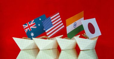 The flags of Australia, the United States, Japan and India are pictured in a reference to the new military alliance and security pact between the countries, called the Quad. (Photo by Shutterstock)
