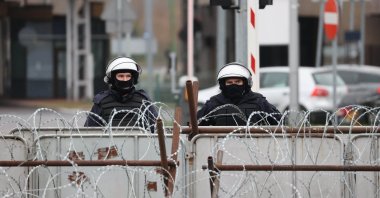 Polish law enforcement officers secure the frontier at the Bruzgi-Kuznica border crossing on the Belarusian-Polish border, Nov. 19, 2021. (AFP Photo)