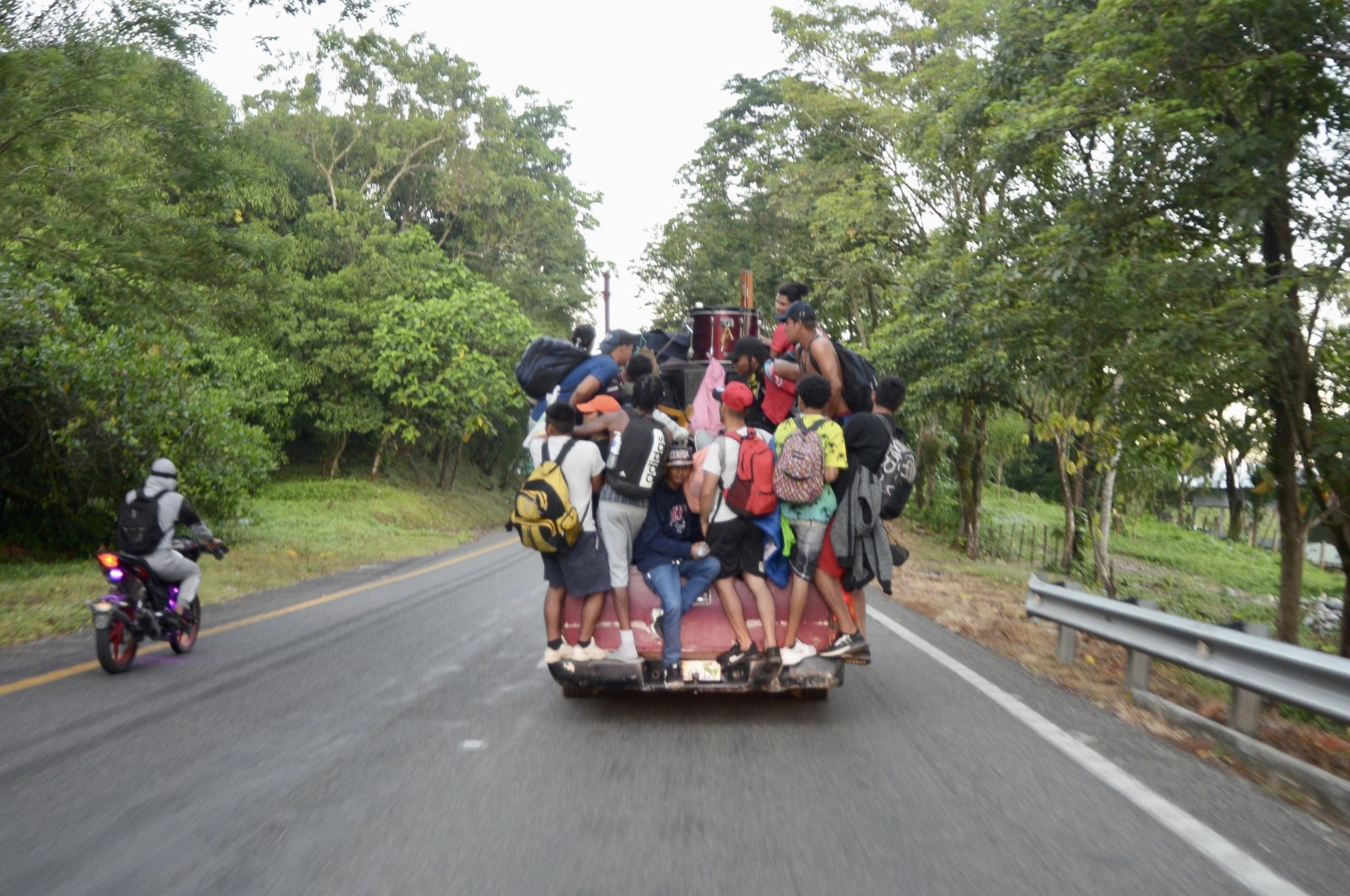 Immigrants crossing into Mexico from Guatemala on the back of a truck, Chiapas, Mexico. (Jacob Garcia/Anadolu Ajansı)