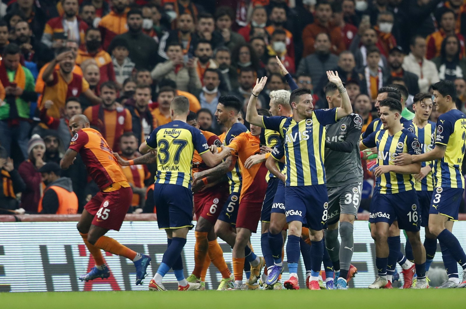 Fenerbahçe and Galatasaray players clash in derby game at Nef Stadyumu, Istanbul, Turkey, Nov. 21, 2021. (Reuters Photo)