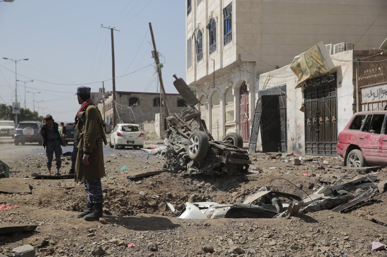A soldier stands at the site of an airstrike by Saudi-led coalition in Sanaa, Yemen, Thursday, Nov, 11, 2021. (AP File Photo)