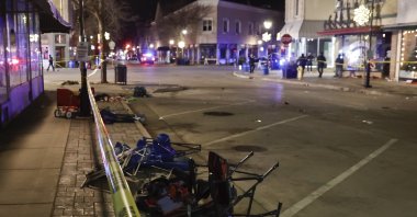 Debris left from crowds attending a Christmas parade lies scattered next to police crime scene tape after a SUV reportedly broke through a barricade and drove into  people including children leaving several people dead and many more injured in Waukesha, Wisconsin, U.S., Nov. 21, 2021. (EPA Photo)