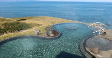 At Geosea in Husavik, in the very north of Iceland, visitors bathe in steaming warm salt water. (dpa Photo)