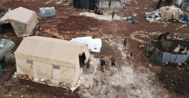 This aerial view shows children in the Bardaqli camp for displaced people in the town of Dana in the northwestern Idlib province, Syria, on Nov. 20, 2021. (AFP Photo)
