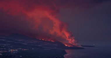 Lava expelled by Cumbre Vieja volcano reaches the sea as seen from Tazacorte in La Palma, Canary Islands, Spain, Nov. 16, 2021.
