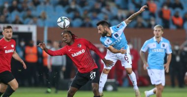 Trabzonspor's Siopis (R) in action with Gaziantep FK's Hamza Mendyl during the Turkish Süper Lig 13th week match at the Medical Park Stadium in Trabzon, Turkey, Nov. 22, 2021 (AA Photo)