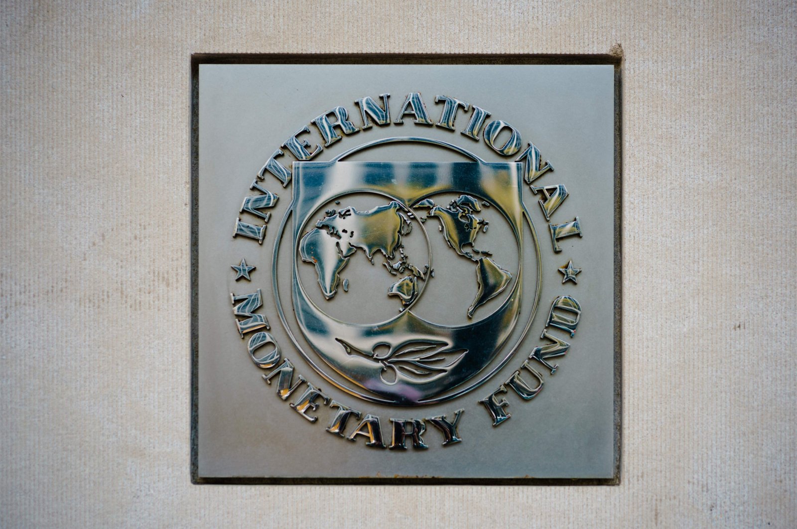 The seal of the International Monetary Fund (IMF) is seen outside its headquarters in Washington, D.C., United States, April 7, 2021. (AFP Photo)