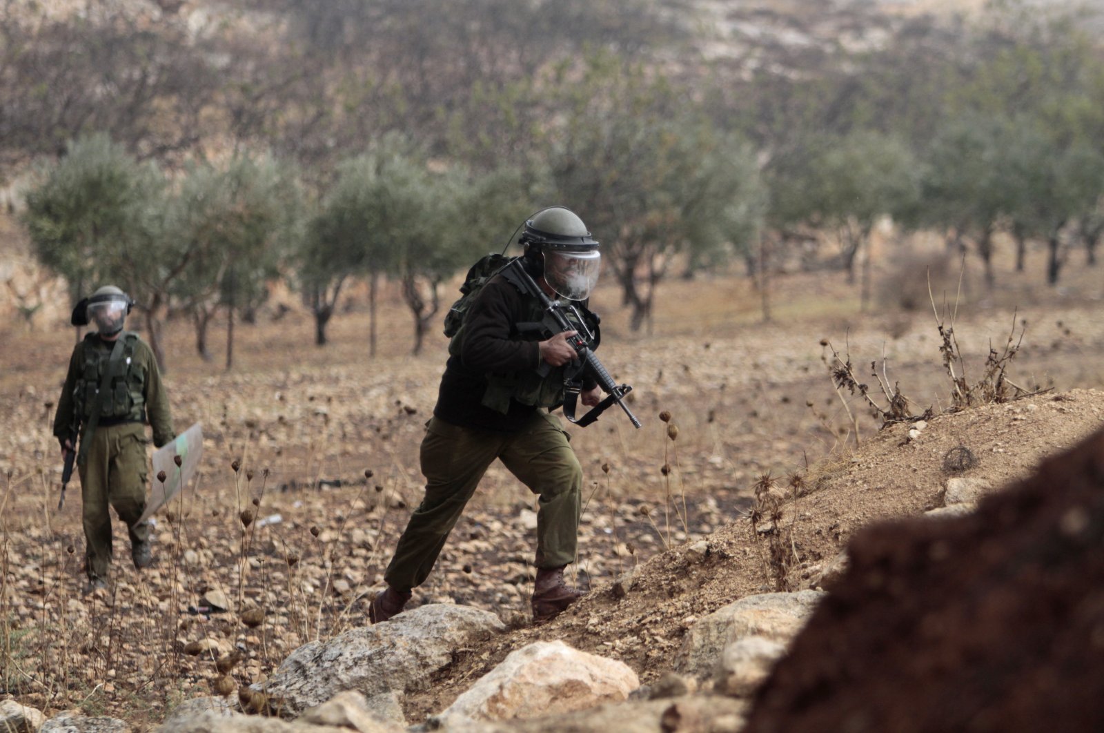An Israeli soldier takes a position during the demonstration against Israeli settlements in the village of Beit Dajan, in the West Bank, Palestine, Nov. 19, 2021. (Photo by Getty Images)