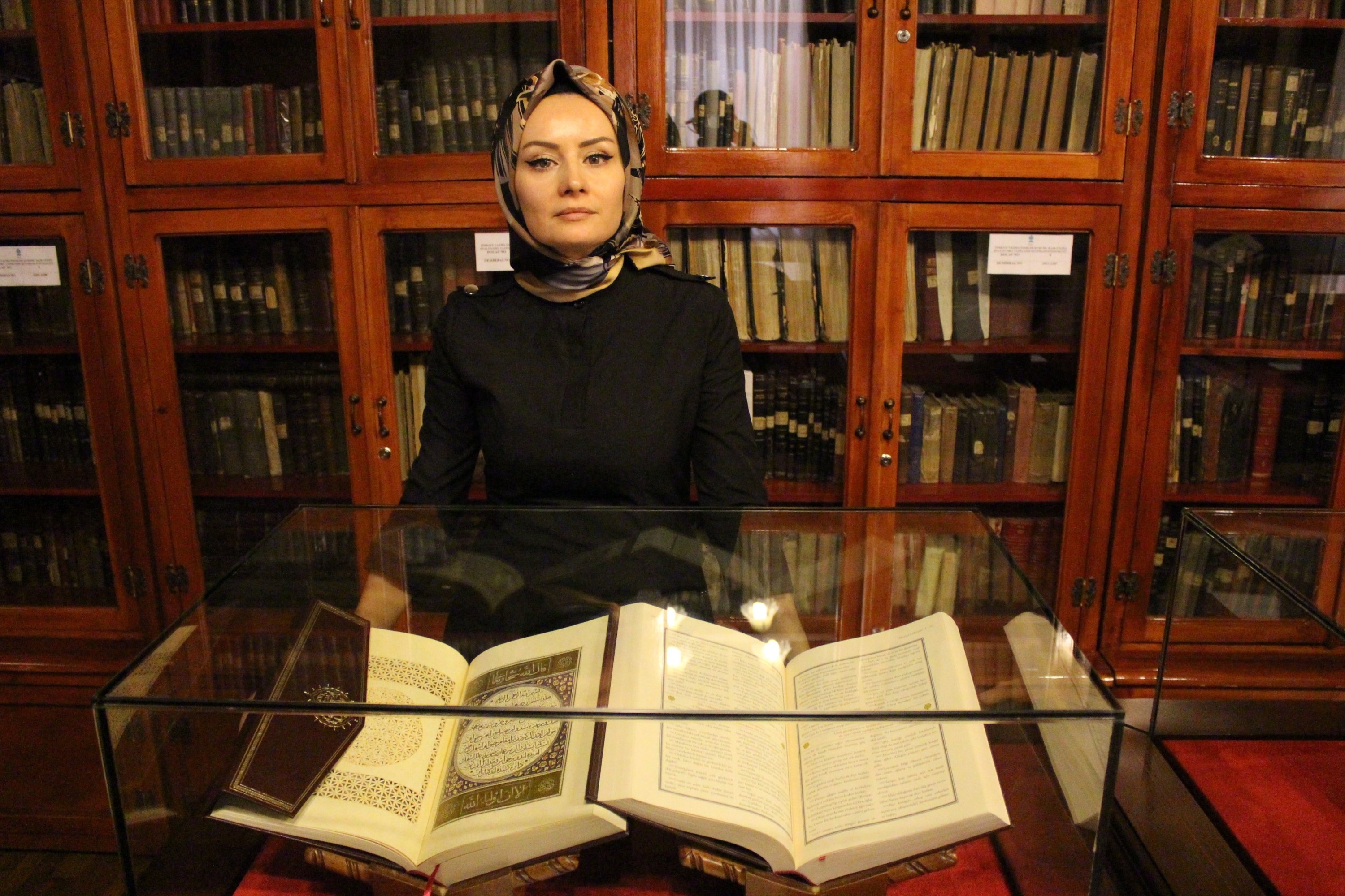 Library Director Dahiye Karagülle is seen together with manuscripts in the historic Ziyabey Manuscripts Library in Sivas, eastern Turkey, Nov. 18, 2021. (IHA Photo)