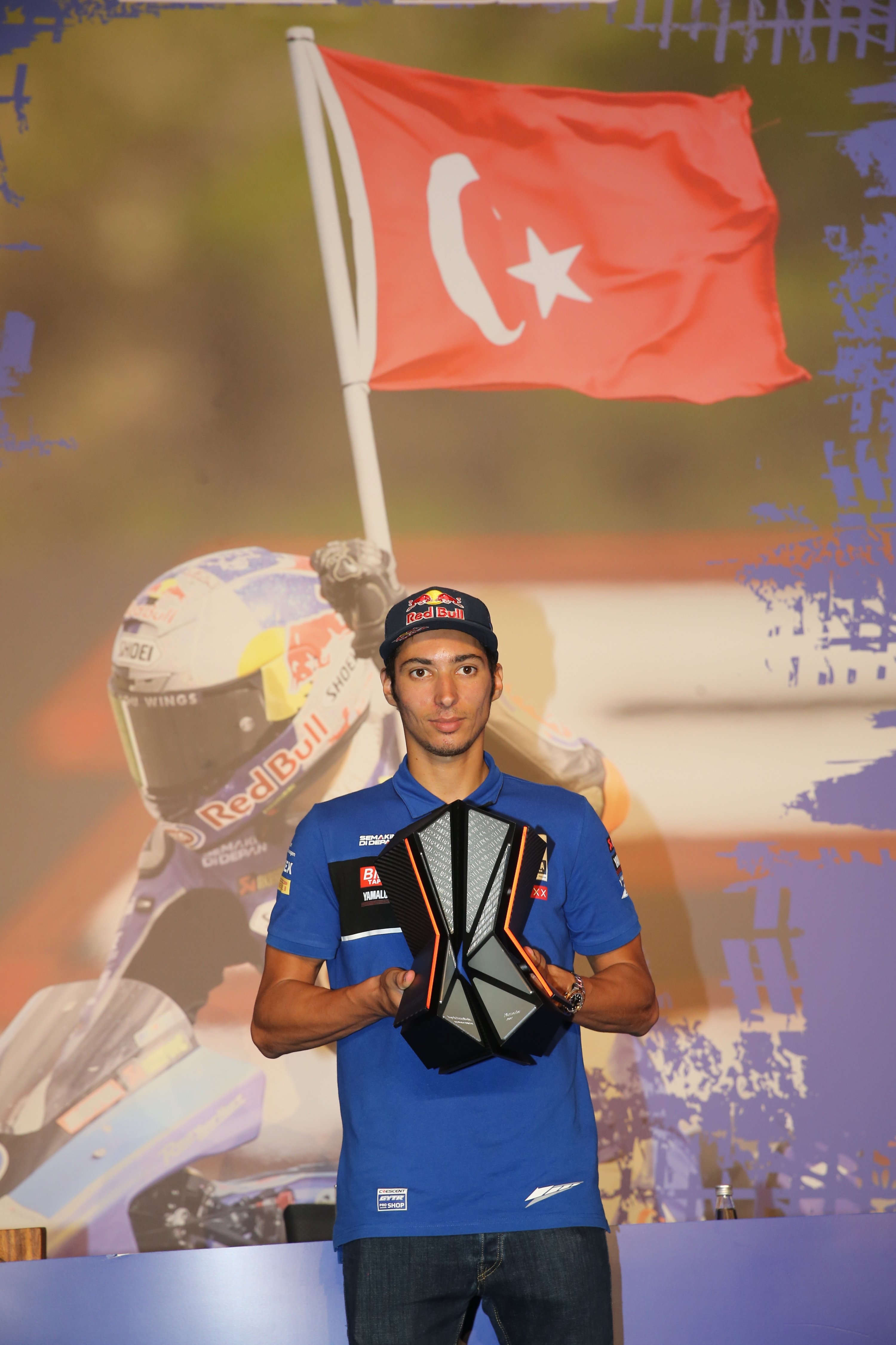 The 2021 Superbike World Championship title winner Toprak Razatlıoğlu (L) poses with the trophy at a press conference, Istanbul, Turkey, Nov. 23, 2021. (AA Photo)