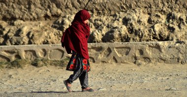 A child walks towards her school in Kandahar, Afghanistan, Nov. 21, 2021. (AFP Photo)