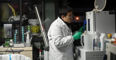 Xu Wei working at his home laboratory in Kunming in southwestern China's Yunnan province, Oct. 21, 2021. (AFP Photo)