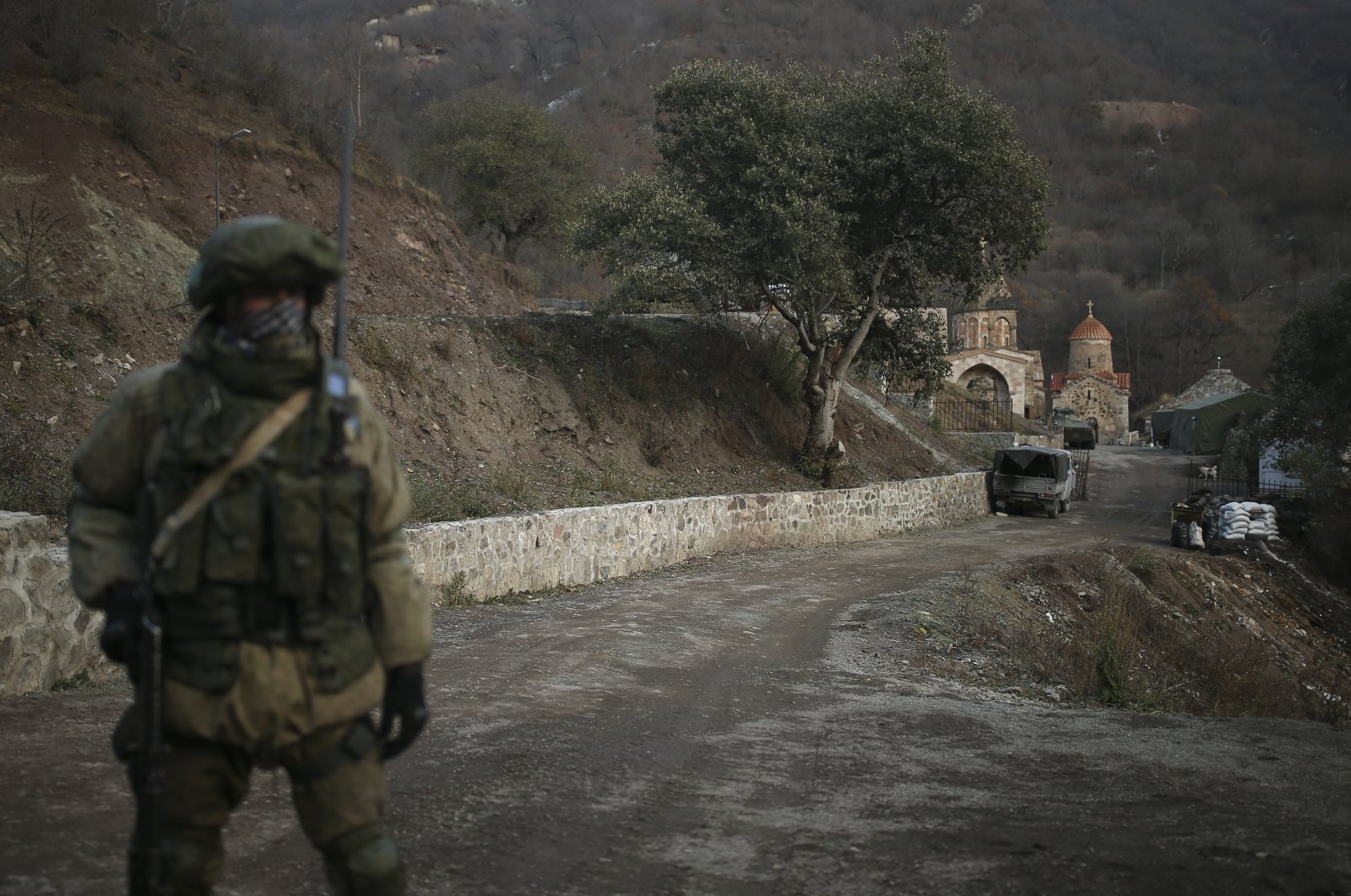 A Russian peacekeeper stands guard at the entrance of the Dadivank, an Armenian Apostolic Church monastery dating to the ninth century, after the transfer of the Kalbajar region to Azerbaijan&#039;s control as part of a peace deal, near Kalbajar, Azerbaijan, Dec. 2, 2020. (AP File Photo)