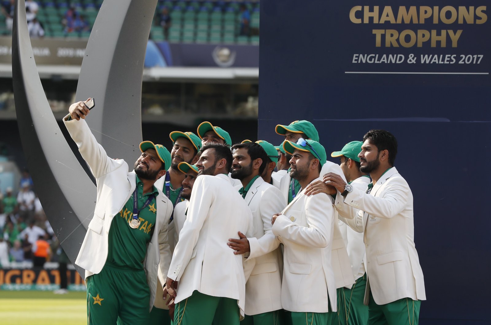 Pakistan players take a selfie at the podium after winning the ICC Champions Trophy at The Oval, London, England, June 18, 2017. (AP Photo)