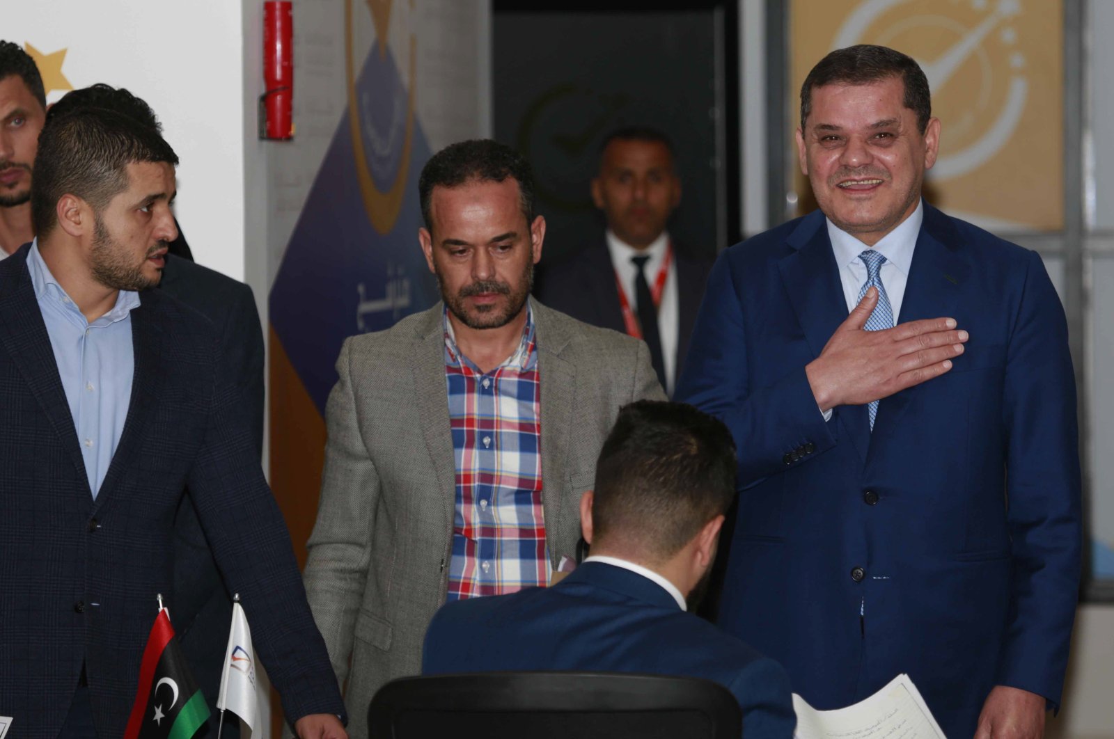 Prime Minister of the Government of National Unity in Libya Abdel-Hamid Mohammed Dbeibah submits his candidacy papers for the presidency of the country to the headquarters of the High National Elections Commission in the capital, Tripoli, Libya, Nov. 21, 2021. (AP Photo)
