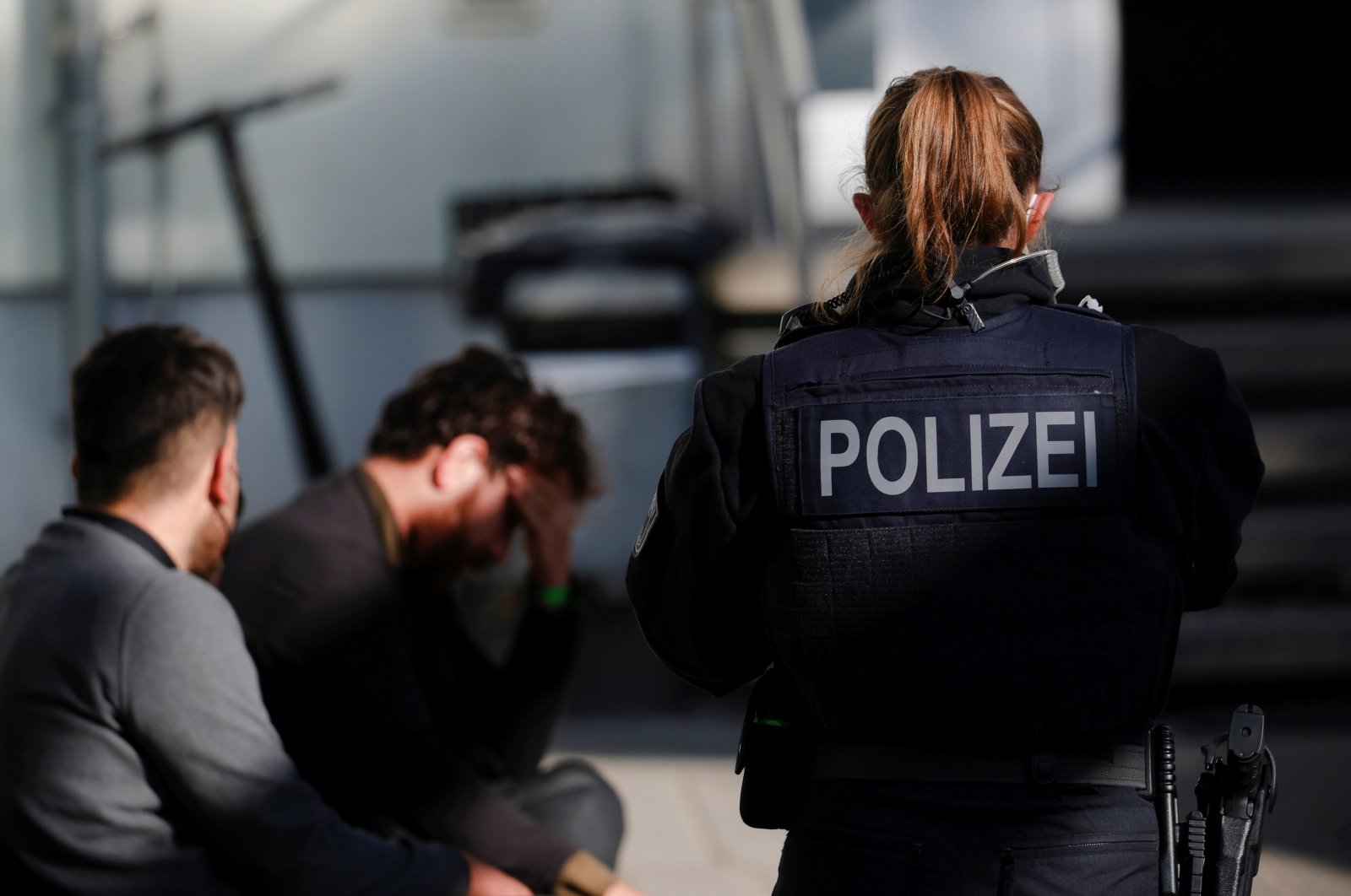 German police officers detain two migrants, reportedly coming from Iraq through Belarus and Poland, during a patrol near the German-Polish border, in Frankfurt (Oder), Germany, Oct. 28, 2021. (Reuters File Photo)