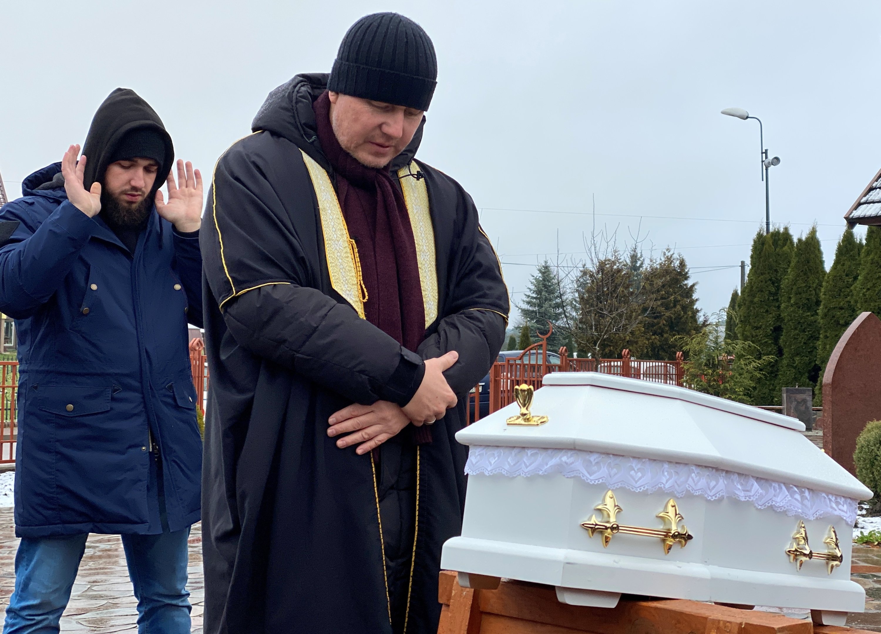 Imam of the village of Bohoniki Aleksander Bazarewicz and a member of the Polish Muslim community attend a funeral of an unborn child Halikari Dhaker, who died in the womb of his mother during the migrant crisis at the Belarusian-Polish border, at a cemetery in the village of Bohoniki near Sokolka, Poland, Nov. 23, 2021. (Reuters Photo)