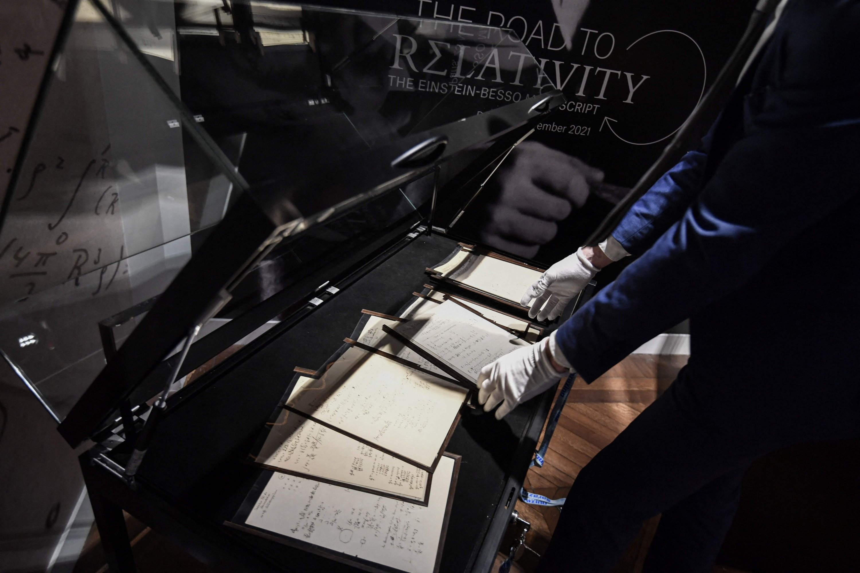 The picture shows the pages of one of the preparatory manuscript to the theory of general relativity of Albert Einstein, during their presentation a day before being auctioned at Christie's auction house in Paris, Nov. 22, 2021.  (AFP Photo)