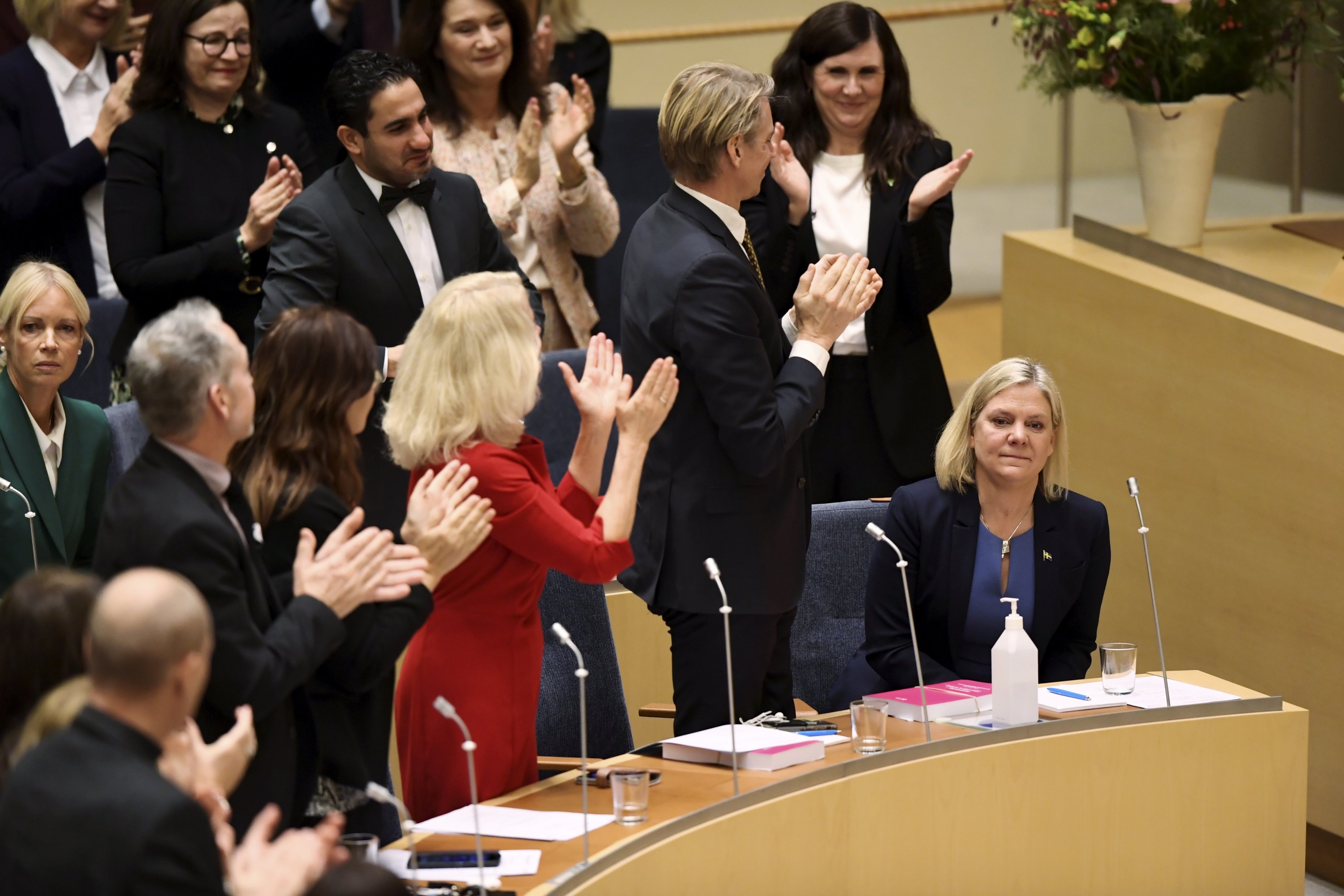 Finance Minister and Social Democratic Party leader Magdalena Andersson (R) is congratulated after being appointed as new prime minister after a voting in the the Swedish parliament in Stockholm, Sweden, Nov. 24, 2021. (Erik Simander/TT News Agency via EPA)