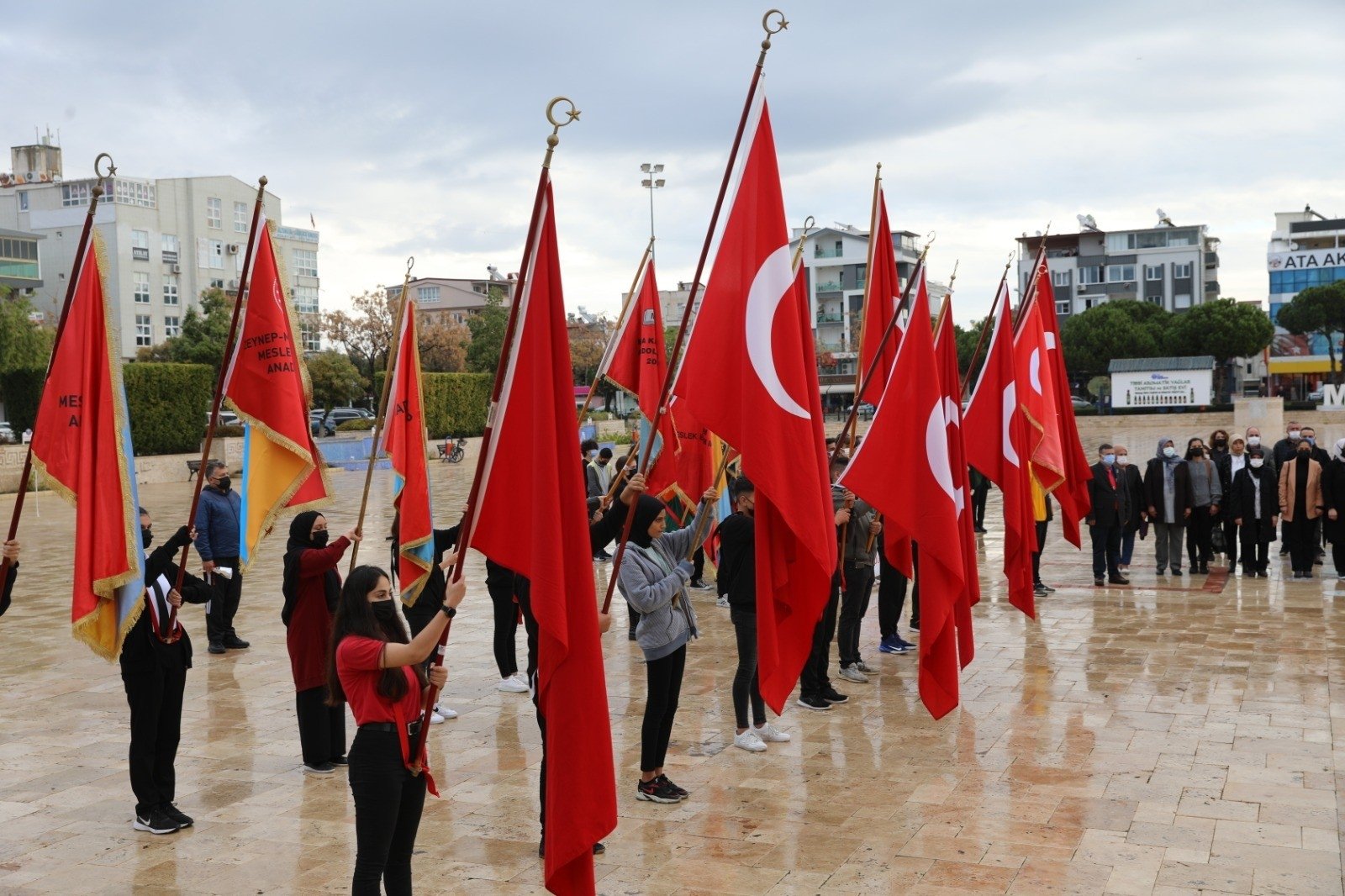 Students hold flags in a ceremony to celebrate Nov. 24 Teachers&#039; Day, in Didim district of Aydın, western Turkey, Nov. 24, 2021. (IHA Photo)