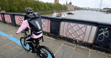A rider from online supermarket Weezy delivers an order amidst the expansion of rapid grocery delivery firms, London, Britain, May 12, 2021. (Reuters Photo)