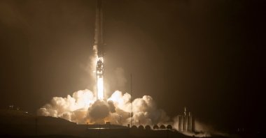 In this handout image courtesy of NASA, the SpaceX Falcon 9 rocket launches with the Double Asteroid Redirection Test, or DART, spacecraft onboard from Space Launch Complex 4E at Vandenberg Space Force Base in California, U.S., Nov. 23, 2021. (Photo by Bill INGALLS / NASA via AFP)