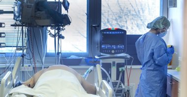 Medical staff attends to a patient at the COVID-19 ICU unit of the hospital in Bratislava, Slovakia, Nov. 23, 2021. (AP Photo)